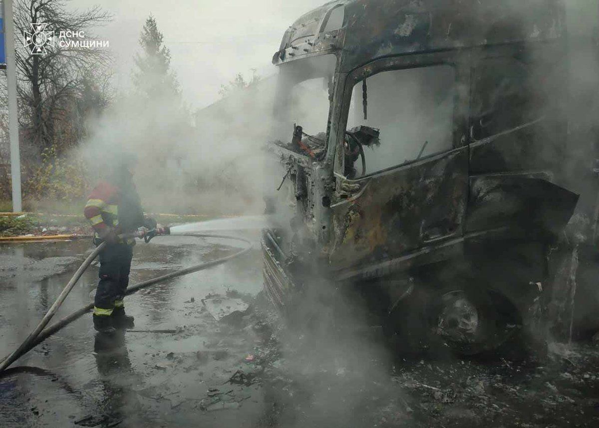A firefighter tackles the aftermath of a Russian drone strike in Shostka, Sumy region, as Thursday's attack on a packed Dnipro railway platform left at least 14 people dead.