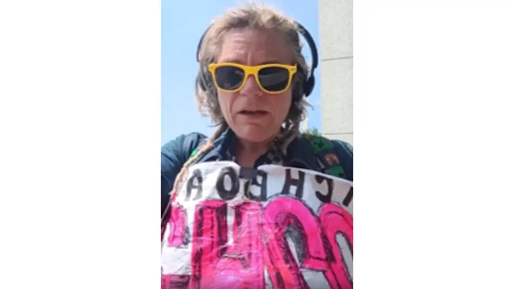 Farris went live on Facebook before surrendering, claiming she defaced the memorial to force her whistleblower case into court.