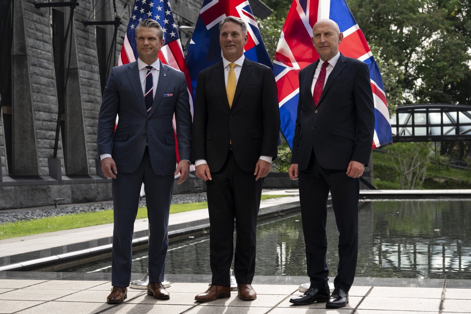 Defence Secretary John Healey, US Defence Secretary Pete Hegseth and Australian Deputy Prime Minister Richard Marles as Britain's Royal Navy fires a…