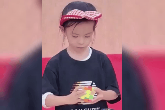 Lian Yunzhi, six, who has memorised more than 1,300 solving algorithms to compete at elite level, becoming the first woman ever to average under 4.5 seconds on the 3x3x3 Rubik's Cube.