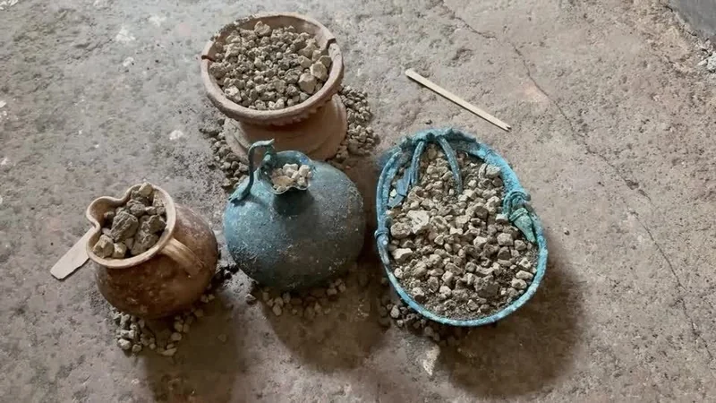 The reconstructed cupboard also held tweezers, a spatula for mixing pigments, a glass perfume bottle, an incense burner, a bronze lamp, and lead weights suggesting the household was involved in trade.