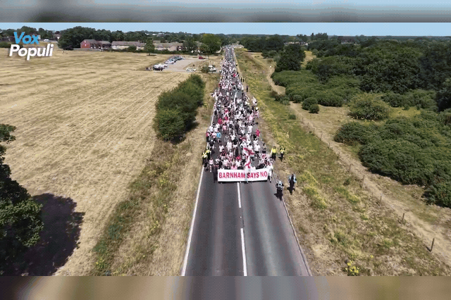 Protesters march through Thetford toward RAF Barnham in August, as villagers voted overwhelmingly on Saturday to pursue a referendum on leaving the UK over the migrant housing plan.