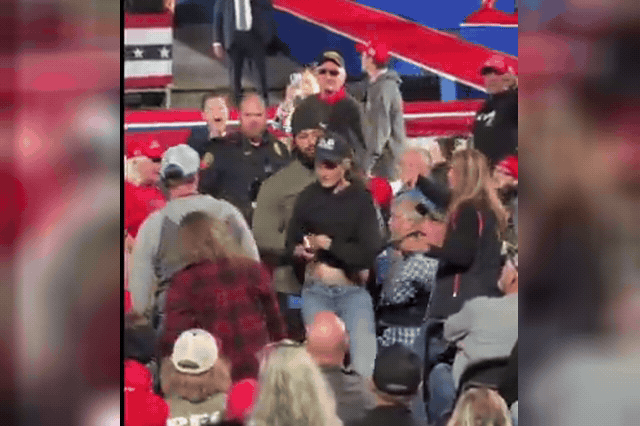 A protester is escorted from the rally as Trump warned supporters that hecklers disrupting his events in North Carolina — and in Texas, Tennessee and Alaska — would be treated "very, very rough.