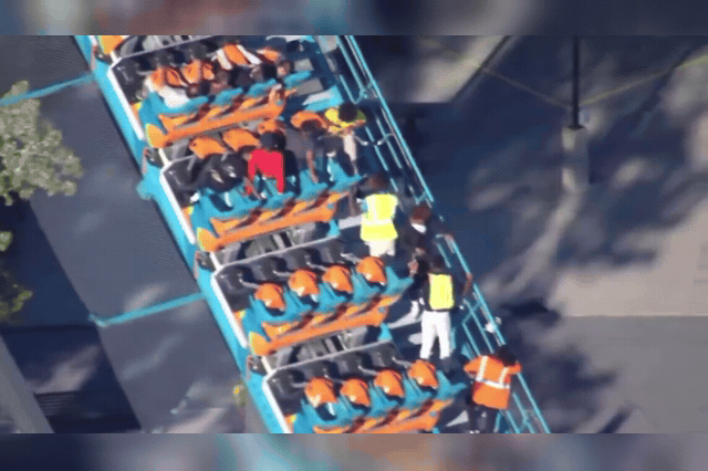 Riders and staff on the Goliath hypercoaster at Six Flags Over Georgia, where a father fell to his death from the 200ft ride while his young son sat strapped in beside him.