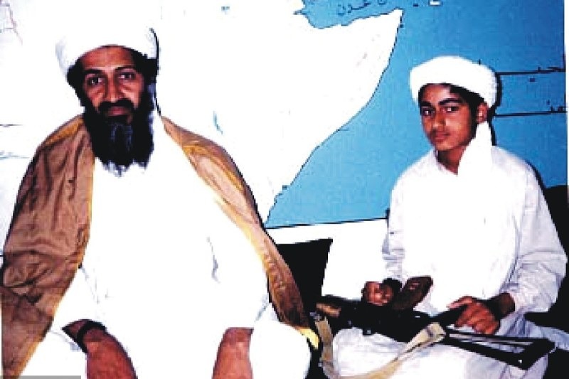Osama bin Laden (left) and his son Hamza bin Laden, who an intelligence assessment warns faked his death in 2019 and is now plotting attacks on Britain.