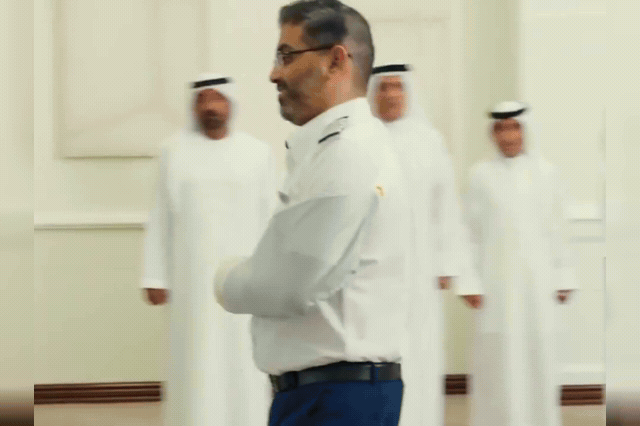 Captain Smit Machchhar displays the deep head wounds visible across his skull as he receives a UAE medal for extraordinary bravery, with co-pilot Hamam al-Hammami facing terrorism charges over the alleged axe attack.