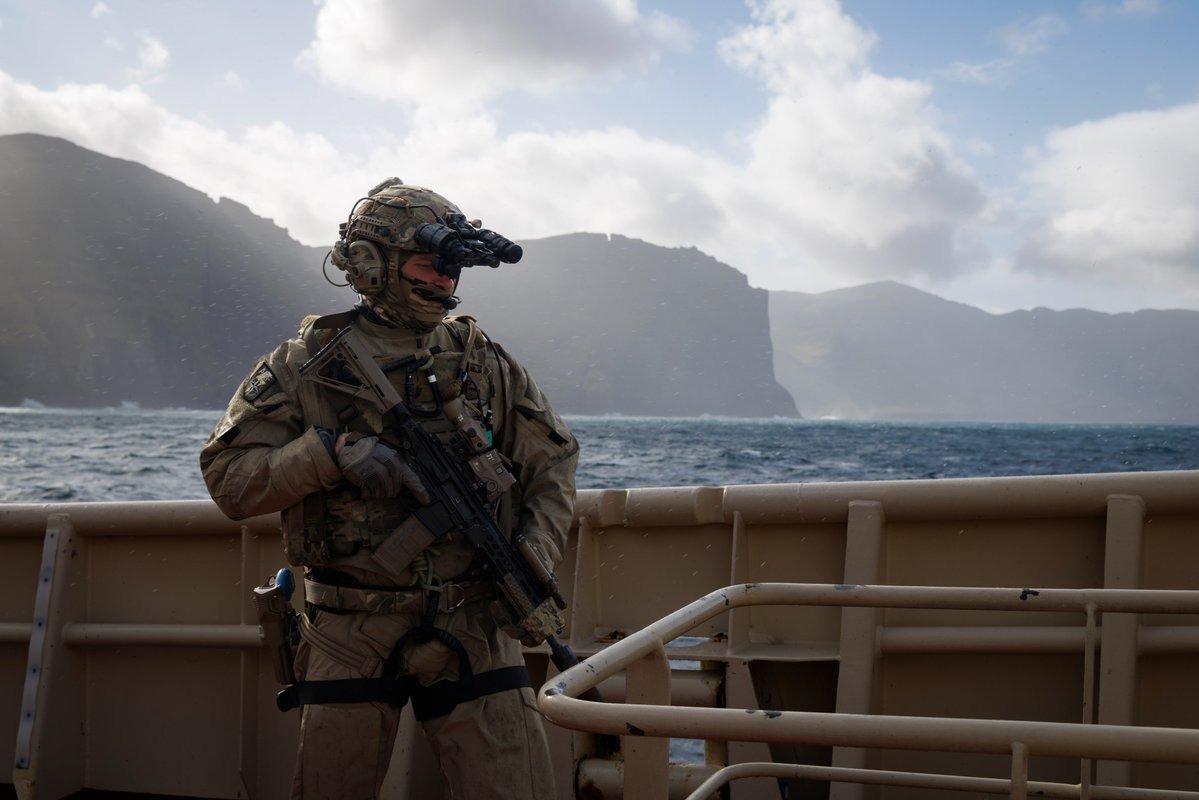A Royal Marine from UK Commando Force aboard a vessel during the Faroe Islands exercise, conducted alongside Danish troops as Russia reportedly builds a new shadow fleet to circumvent Western sanctions.