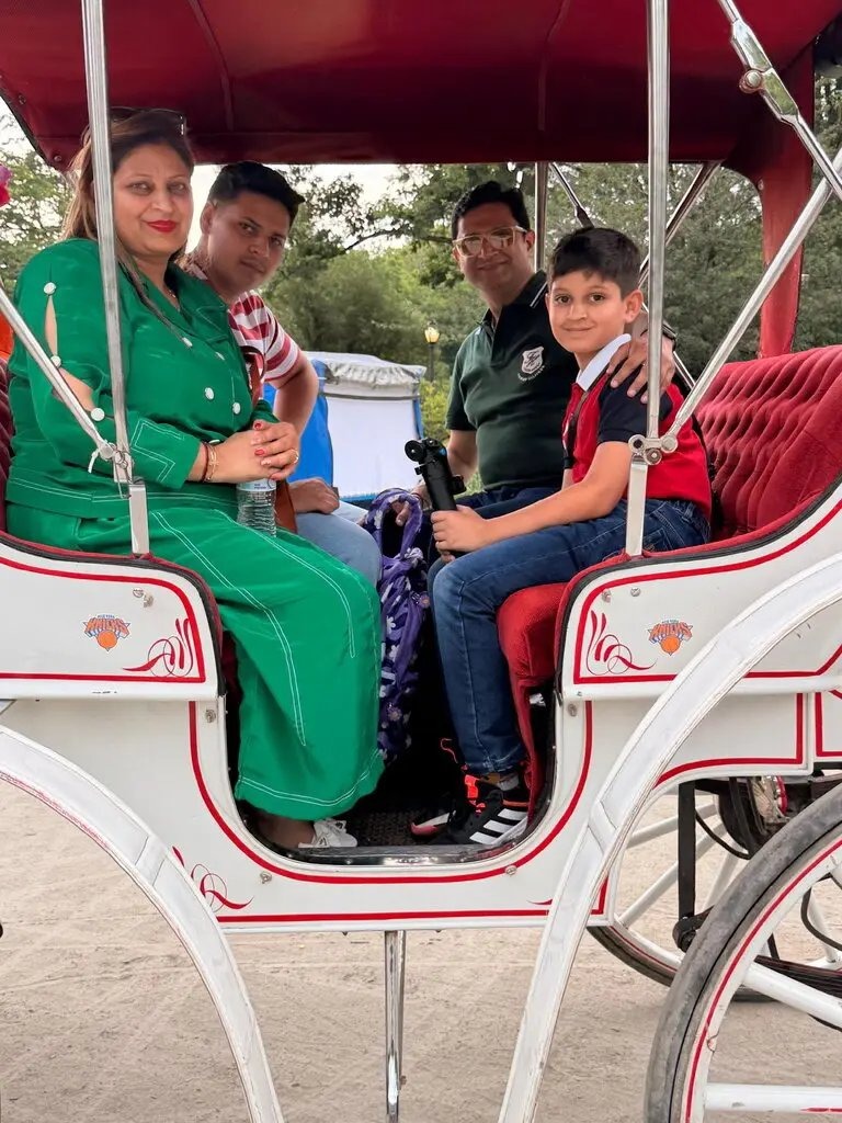 Romanch Mahajan with his family, whose death in a Central Park runaway carriage accident in June prompted New York City to agree to ban horse-drawn carriages entirely by 2028.