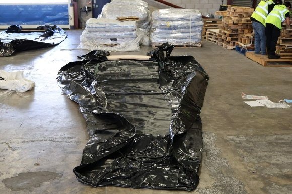 A deflated small boat from the haul, part of a second major seizure this year after a near-identical July operation at Felixstowe netted 25 boats and engines.