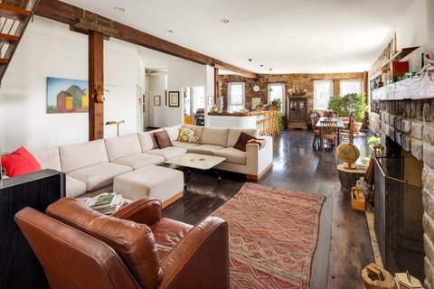 The penthouse loft interior, where developer David Puchkoff worked with architect Lawrence Tobe to create a four-bedroom home with ceilings over ten feet, inspired by a friend's Pennsylvania lakefront retreat.