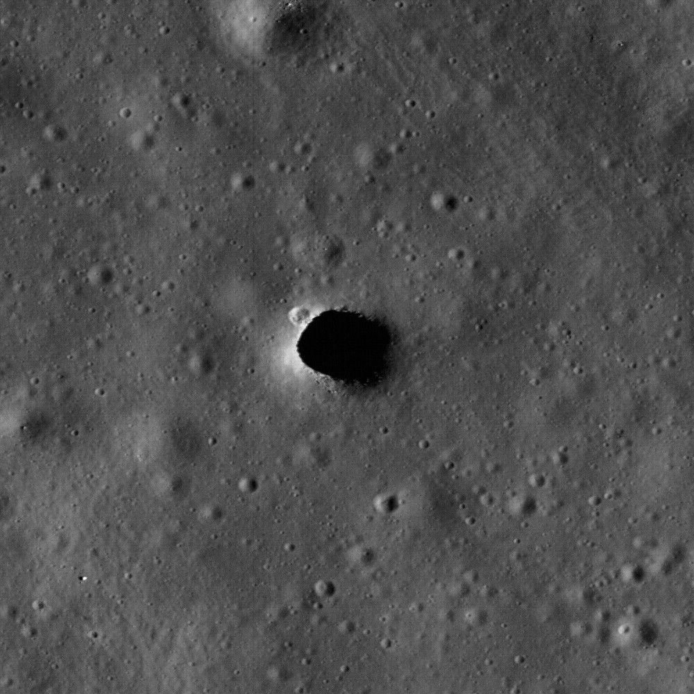 The Marius Hills Pit on the lunar surface, which NASA's GIMLI project will probe using ground-penetrating radar and seismic sensors to determine whether it opens into a cavern large enough to shelter astronauts.