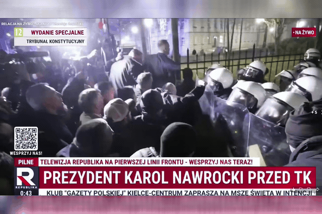 President Karol Nawrocki pushes through the police cordon outside the Constitutional Tribunal shortly before 1am. Government-appointed judges had suspended the court's president, Bogdan Święczkowski, a move the tribunal itself called 'the crime of a coup d'état'.