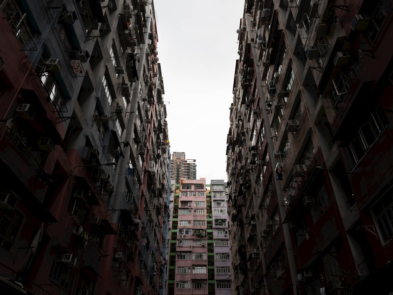 A couple of tall buildings sitting next to each other