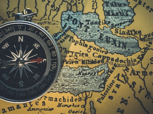 Top view of a compass on a map