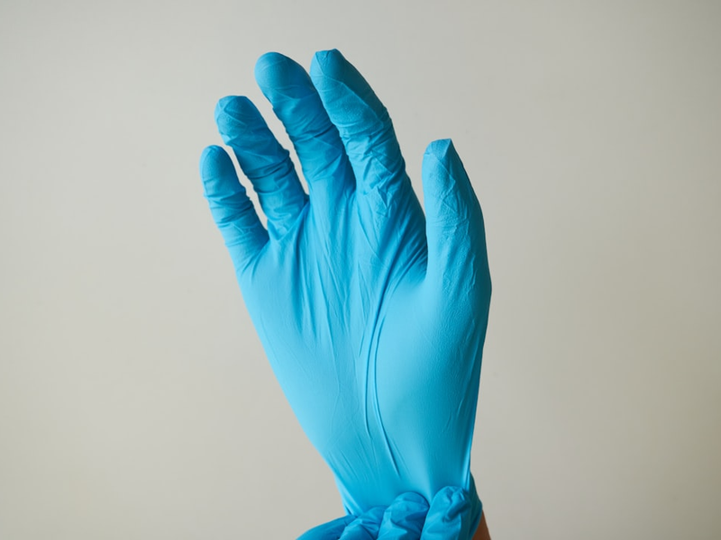 persons hand with blue light