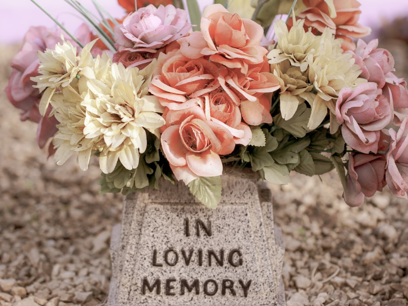 Faded flowers on a grave