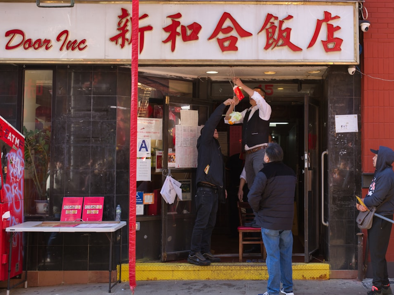 New York, New York - February 28, 2026: Traditional lion dance troupes and thousands of spectators gather on Hester Street for the "Super Saturday" Chinatown Lion Dance Festival and ceremonial firecracker display. Celebrating the 2026 Lunar New Year—the Year of the Fire Horse—the event features rhythmic drumming, vibrant costumes, and the traditional lighting of firecrackers to ward off evil spirits and bring good fortune. The massive street festival in Manhattan's Chinatown is a cornerstone of the city's cultural calendar, showcasing ancestral Chinese traditions, martial arts-infused dance performances, and community celebrations that draw residents and tourists to the historic neighborhood for the final peak of the New Year festivities.