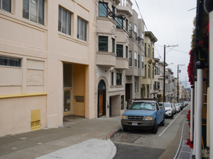a street with cars parked on the side
