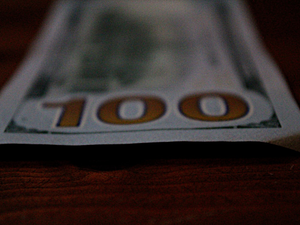 a close up of a hundred dollar bill