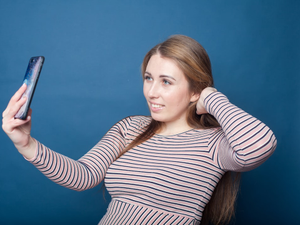 a woman holding a phone