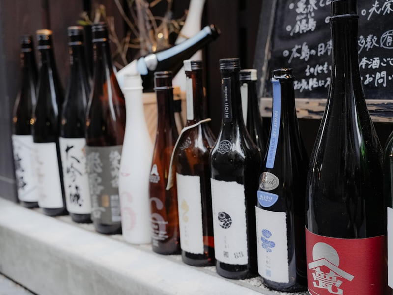Row of japanese sake bottles with labels