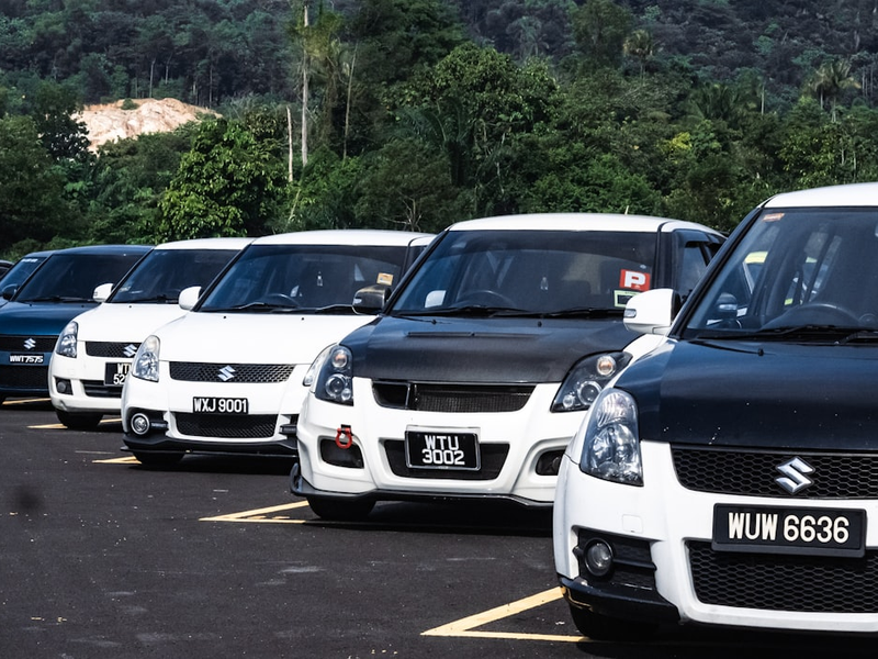 a group of cars parked in a parking lot