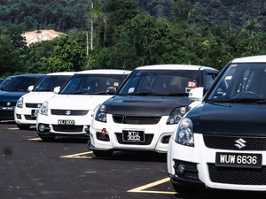 a group of cars parked in a parking lot