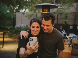 Two entrepreneurs and co-founders take a selfie for former colleagues during a business dinner event in Healdsburg, CA (outside San Francisco). 