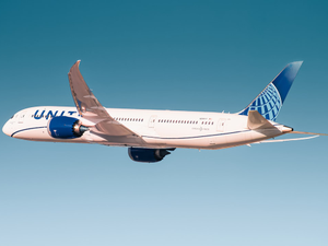 white and blue passenger plane in flight