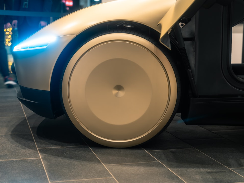 A close up of a robot on a tiled floor