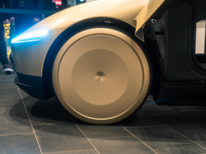 A close up of a robot on a tiled floor