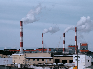a factory with a lot of smoke coming out of it