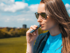 Woman Vaping on Electronic Cigarette (JUUL)