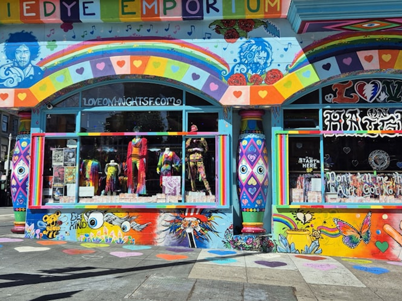 A brightly colored building on a city street