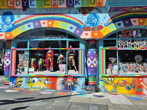 A brightly colored building on a city street