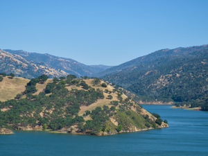 A large body of water surrounded by mountains