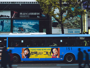 yellow and black bus on road during daytime