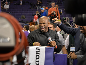 Deion Sanders enjoys the crowd at Super Bowl XLIV media day