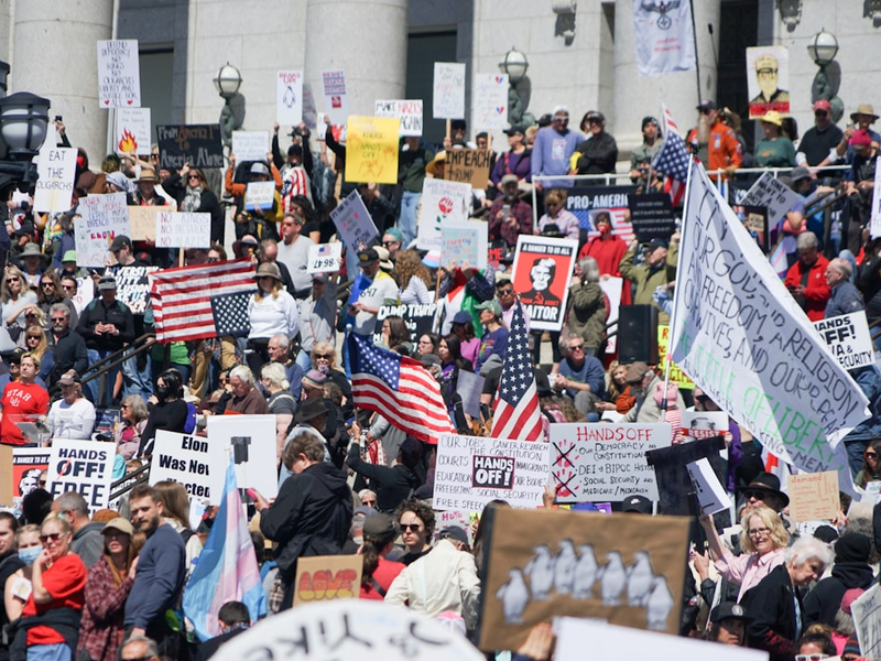 Utahns protest the actions of Donald Trump and Elon Musk outside the Utah State Capitol.