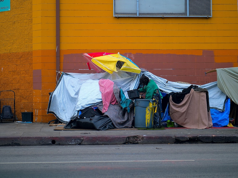 A group of tents sitting on the side of a road