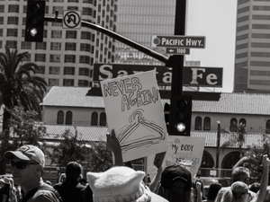a crowd of people holding signs