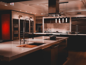 A large kitchen with a center island and stainless steel appliances