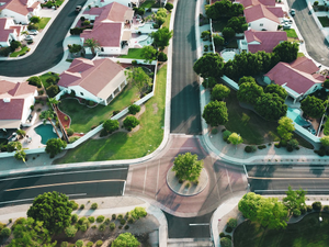 Drone shot looking forward in a suburb.