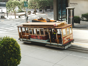 a trolley car traveling down a city street