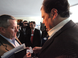 Salesforce.com CEO Marc Benioff exchanges business cards