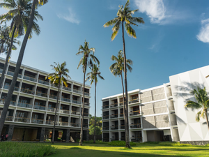 white concrete building near green grass field during daytime
