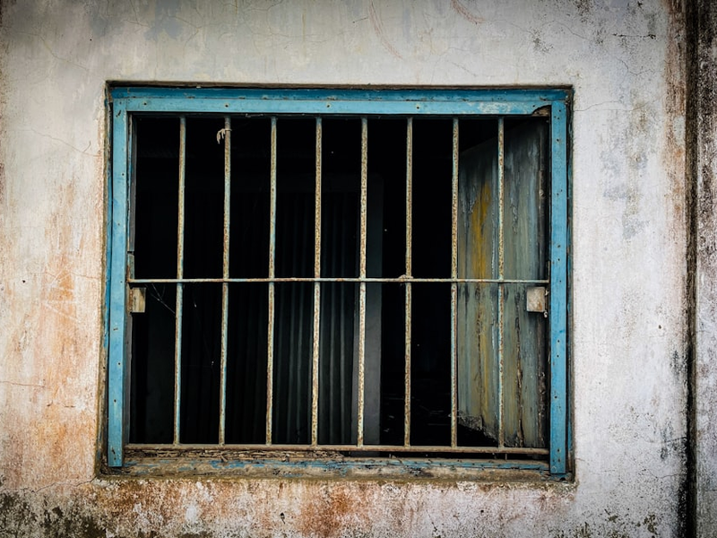 a window with bars on the outside of it