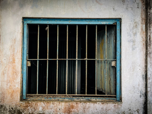 a window with bars on the outside of it