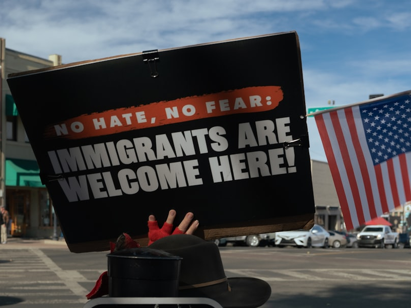 Protest sign reads immigrants are welcome here