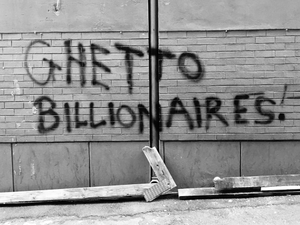 a black and white photo of graffiti on a wall